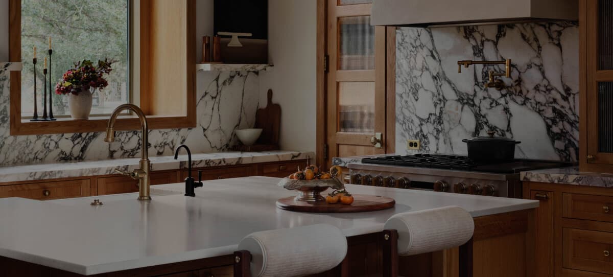 A kitchen counter with a sink and a faucet