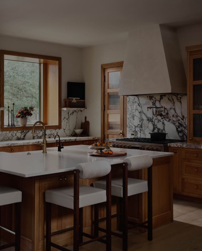A kitchen counter with a sink and a faucet